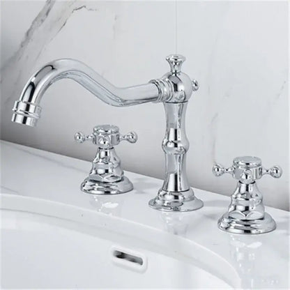Chrome finished ornate vintage style basin faucet with curved spout and double cross handles for brass gold bathroom use