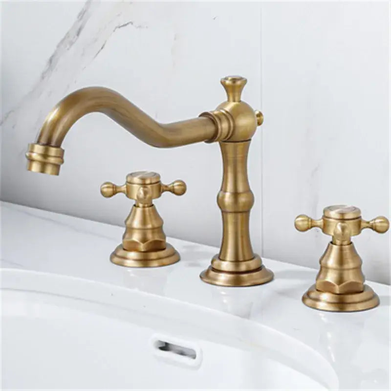 Decorbites antique brass gold bathroom basin faucet with three ornate cross handles in brass gold bathroom finish