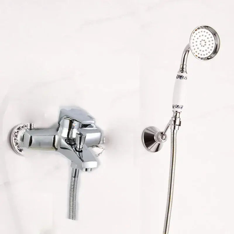 Chrome-finished shower head kit with white ceramic handle and decorative chrome accents for wall mounted bathtub use