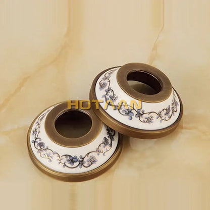 Decorbites antique brass shower head kit features ceramic toilet paper holders with blue floral patterns on white background