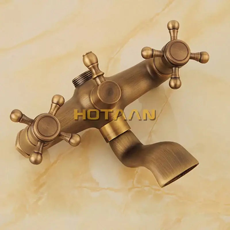Decorbites antique brass dual-handle wall-mounted shower head kit with ornate cross-shaped handles and curved spout