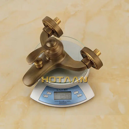 Decorbites™ antique brass bathroom faucet with classic design and dual handles as part of shower head kit y t 5360 a