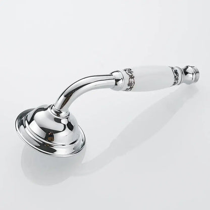 Chrome finished hand held shower with white ceramic handle and intricate silver floral detailing in brass hand held design