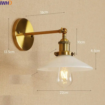 Decorbites antique brass industrial wall sconce with frosted glass shade and exposed filament bulb in swing arm design