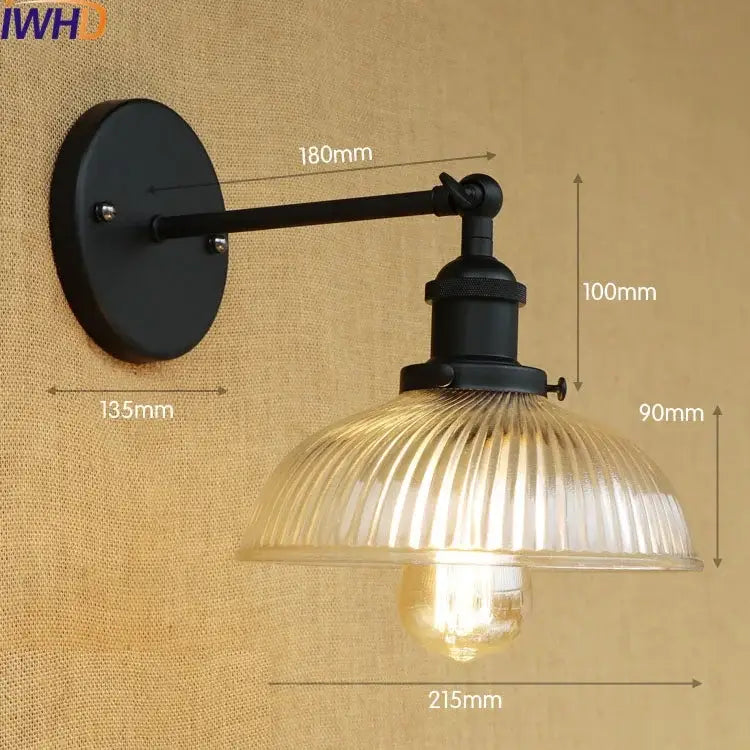 Black wrought iron wall sconce with ribbed glass shade and exposed bulb for antique brass industrial wall light fixtures