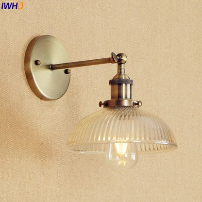 Antique brass industrial wall sconce with ribbed clear glass shade and exposed Edison bulb vintage wall light fixture