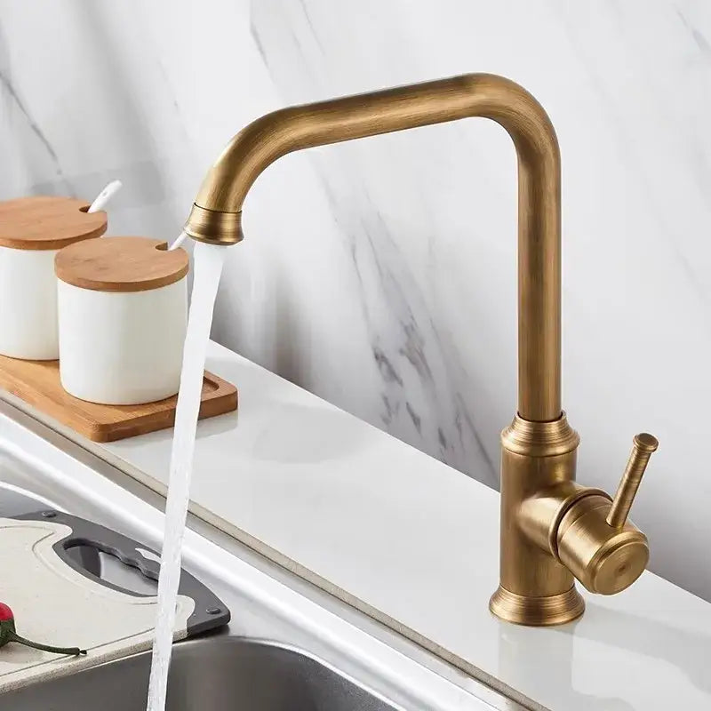Decorbites™ antique brass kitchen faucet with curved spout single lever handle and 360° swivel for hot cold use