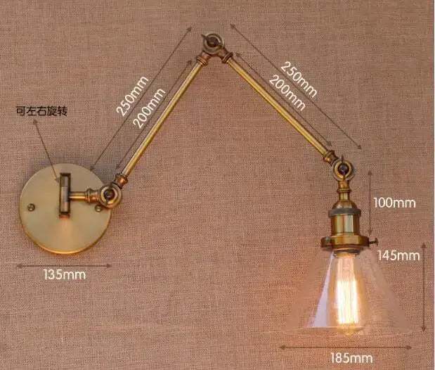 Decorbites antique brass swing arm wall lamp with clear glass shade and exposed filament bulb in industrial loft style