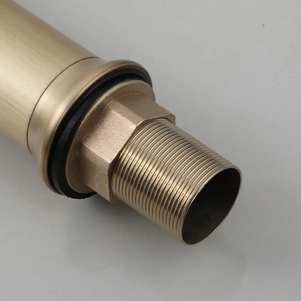 Gold-colored brass pipe fitting with threaded end and black rubber seal for decorbites antique brass oil bathroom faucet