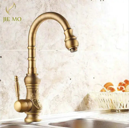 Decorbites antique brass porcelain basin mixer kitchen faucet with ornate detailing and 360 degree swivel spout