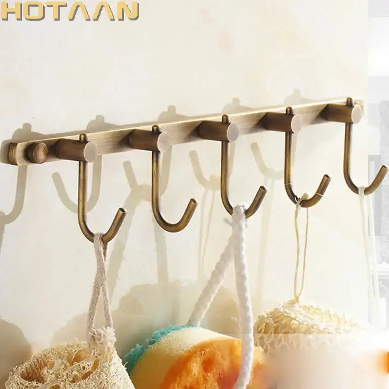 Antique brass robe hook rack by DecorBites with five hooks for stylish bathroom organization and storage