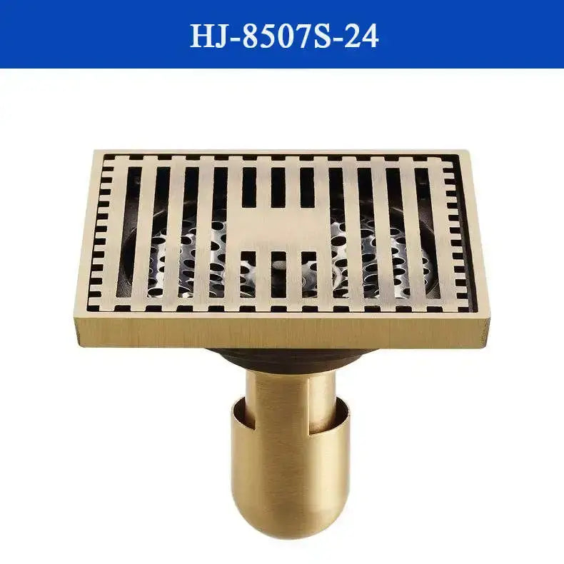 Brass shower drain cover with vertical slats and cylindrical base in antique brass for bathroom use by DecorBites
