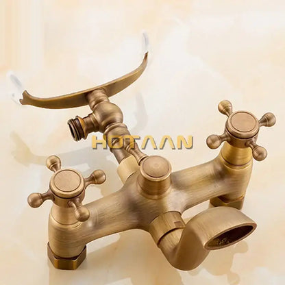 DecorBites antique brass shower faucet kit with brass finish, cross handles, and curved handheld showerhead