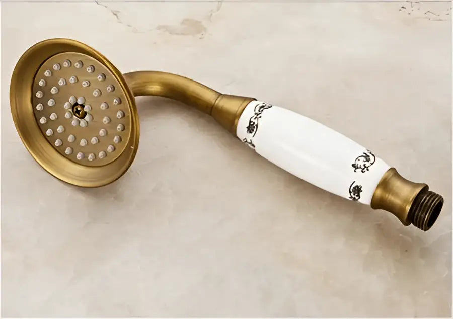 Decorbites antique brass shower faucet set with rain head featuring white ceramic and black floral detailing