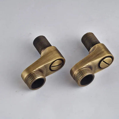 Antique brass l-shaped plumbing fittings with threaded ends and circular indentation for DecorBites shower faucet set