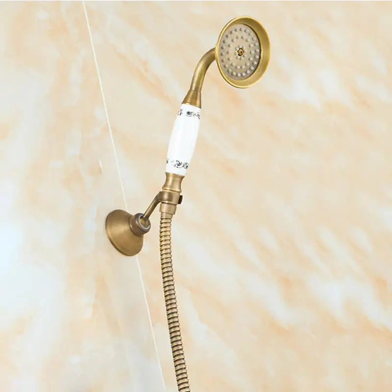 DecorBites™ antique brass shower set with 8 inch white ceramic rain head featuring decorative floral patterns