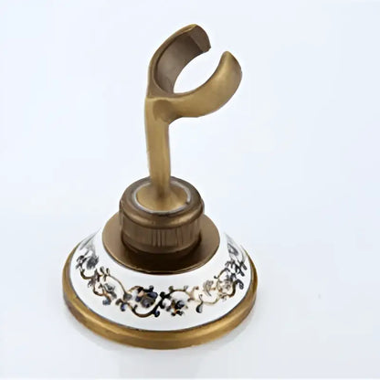 Antique brass shower set metal hook with ornate floral patterned ceramic base in decorbites™ shower set