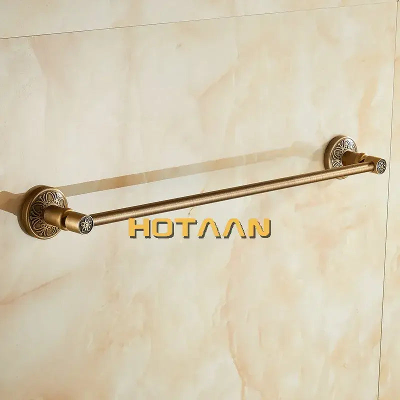 Decorbites™ antique brass single towel bar featuring ornate floral-patterned circular ends wall mounted holder