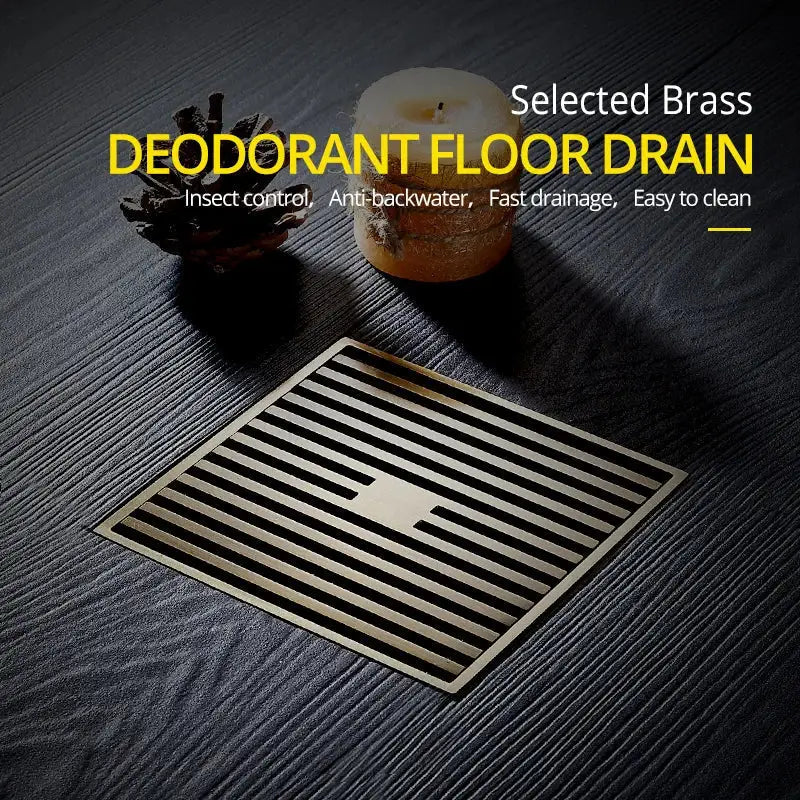 Selected brass square bath drain strainer in antique brass featuring parallel slats and a central rectangular opening