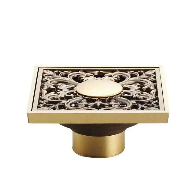 DecorBites antique brass square fish carved floor drain with floral cutout and central medallion for bathroom use