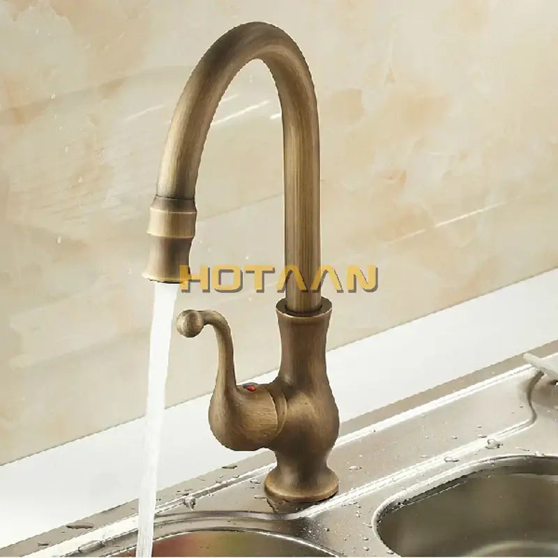DecorBites™ antique brass swivel basin mixer tap with curved spout and ornate handle for elegant kitchen use