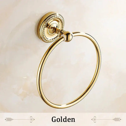 DecorBites antique brass towel ring with ornate twisted mounting plate and polished reflective finish bathroom towel holder