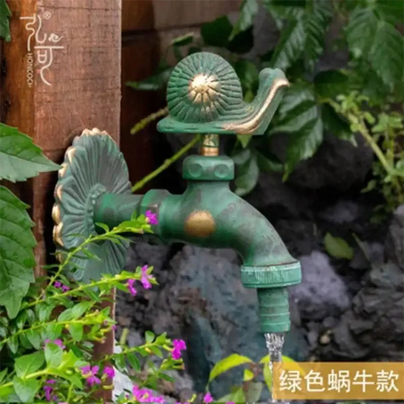 DecorBites™ antique brass wall mount garden faucet with green snail animal design and decorative brass shell accents