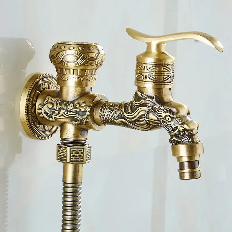 DecorBites™ antique brass wall mounted bidet faucet with ornate dragon head and intricate floral detailing on the spout