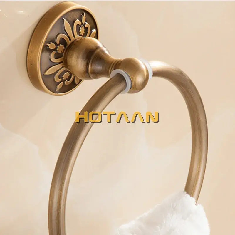 DecorBites antique brass round towel holder with ornate floral detailing for classic bathroom use