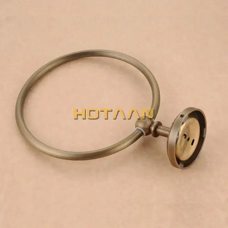 DecorBites antique brass wall-mounted round towel ring holder with a sturdy mounting base for secure installation