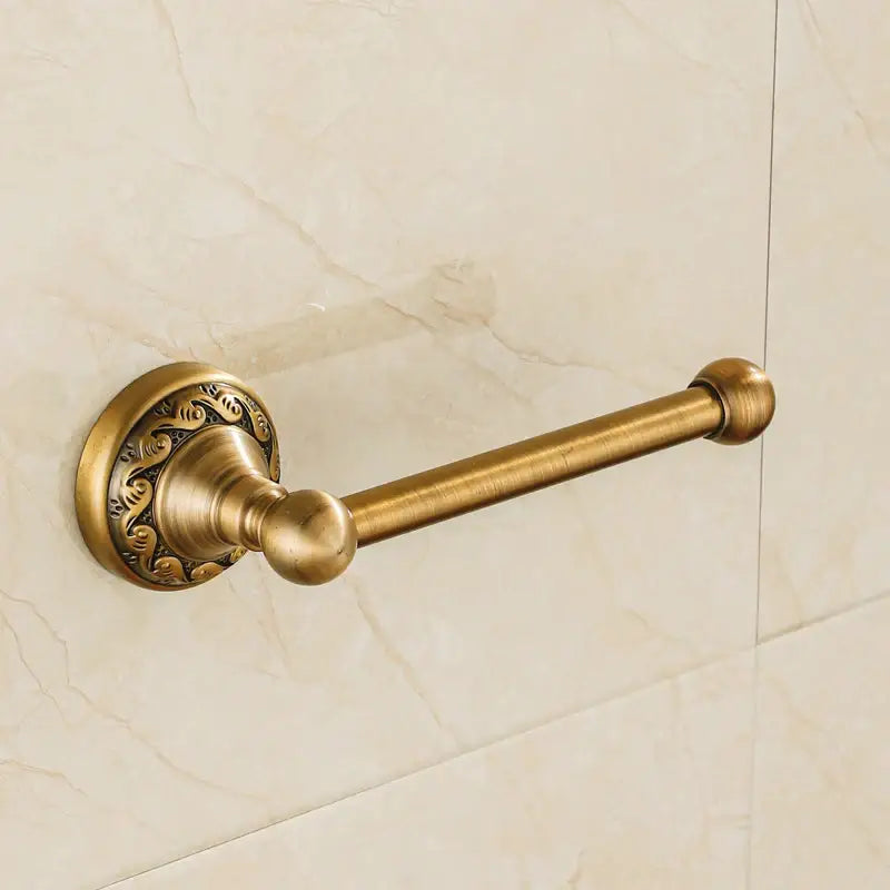 DecorBites™ antique brass wall mounted toilet paper holder with ornate floral engraving and polished spherical ends