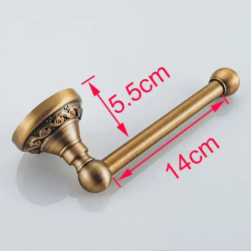 DecorBites antique brass toilet paper holder with ornate floral detailing and spherical finials for vintage bathroom use