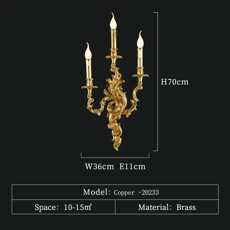 Gold-colored ornate antique brass wall sconce with three candle-style lights for vintage and rococo decor lighting