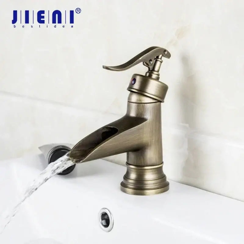DecorBites antique brass waterfall basin faucet with jienai single-handle and art design handle for bathroom
