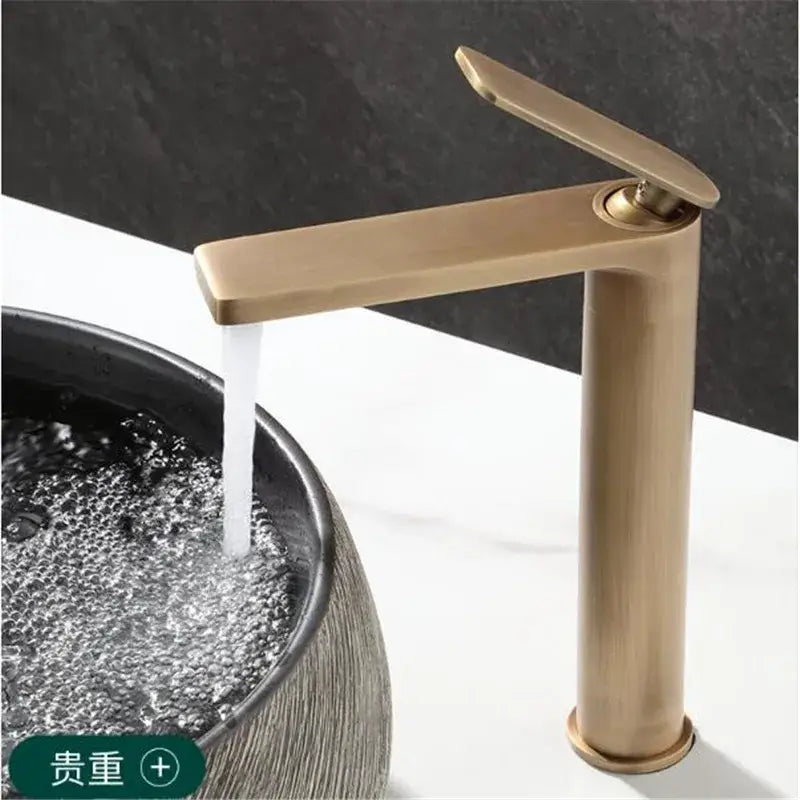 Modern brass-finished tall basin faucet with sleek minimalist design in antique bronze for bathroom sink use