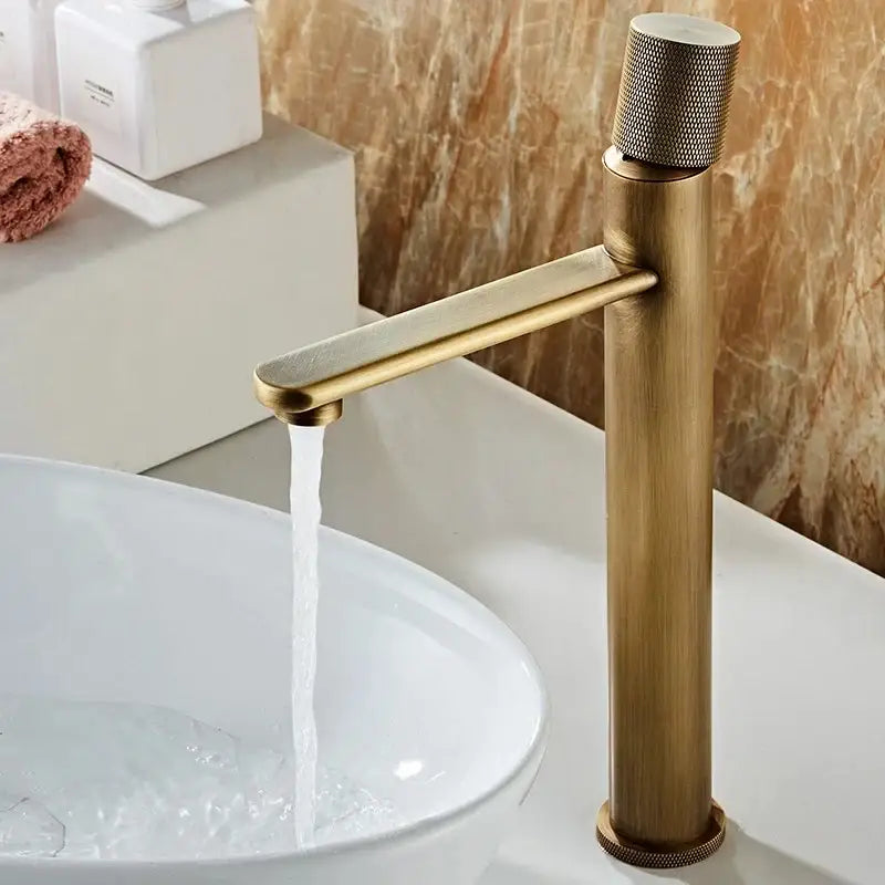 DecorBites™ antique bronze basin faucet with brass finish single-handle and knurled knob for hot and cold deck mounting