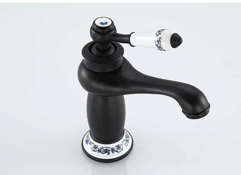 DecorBites™ antique bronze single handle bathroom faucet with black matte finish and white ceramic base with blue floral real shot details