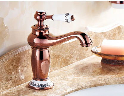 DecorBites antique bronze single handle bathroom faucet with rose gold finish white ceramic handle and ornate black floral base real shot details