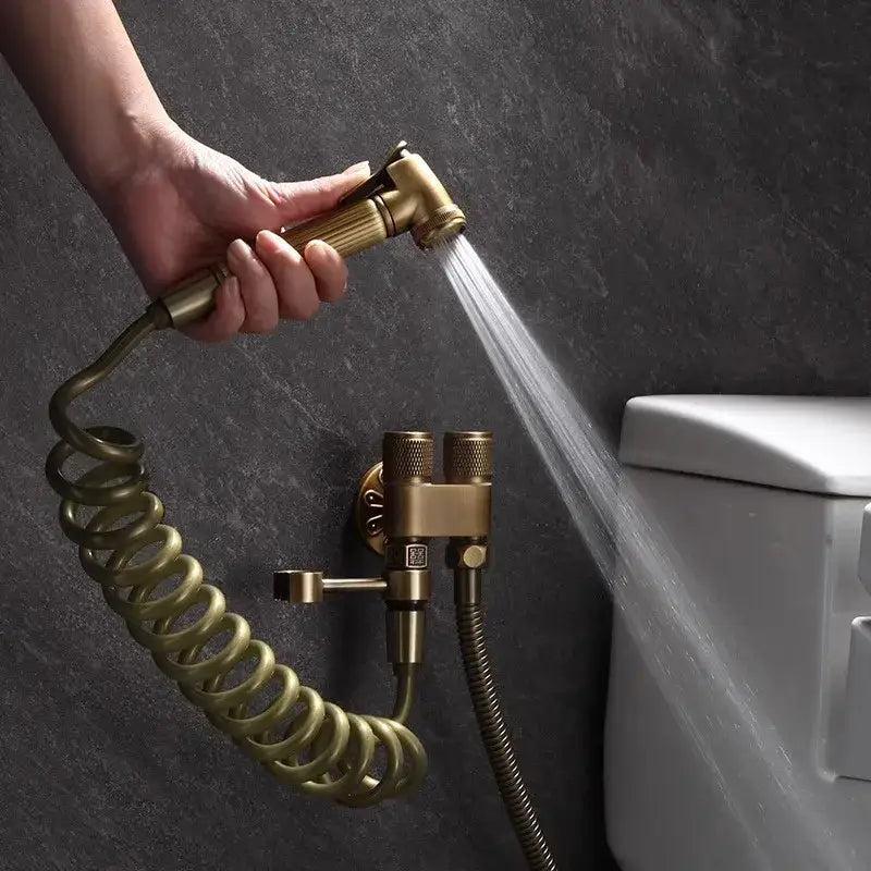 DecorBites™ antique bronze bidet sprayer set with brass handheld nozzle, coiled hose, and dual-handle wall mount
