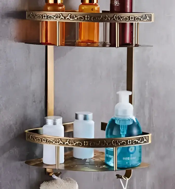 Gold-toned antique bronze carved double-tier bathroom shelf with ornate scrollwork edges in bronze carved aluminum