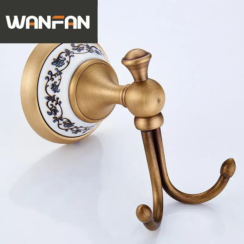 Decorbites antique bronze ceramic robe hook with double brass hooks and white backplate with blue floral patterns