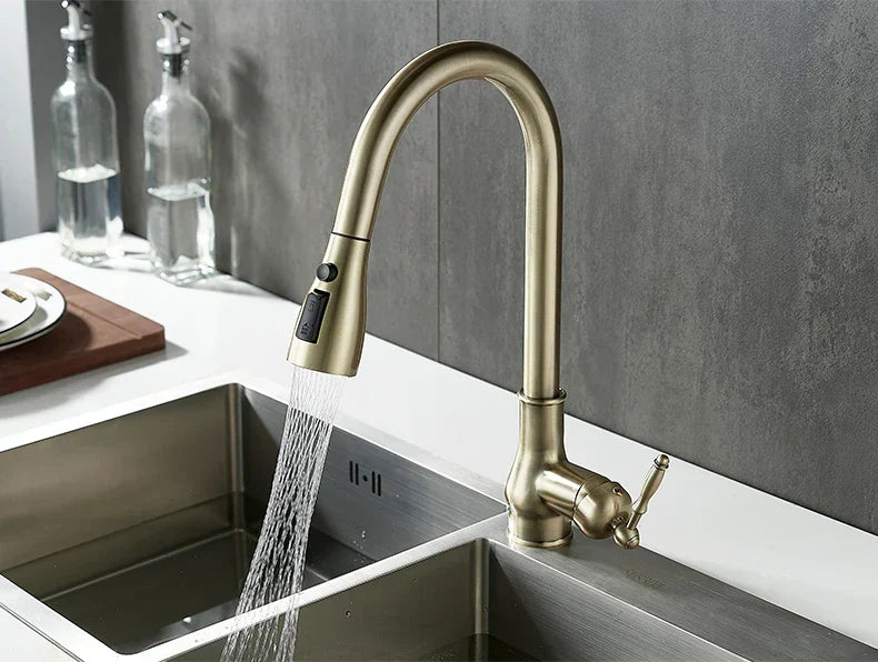 Decorbites antique bronze kitchen faucet with brass finish and pull-down spray head in a sleek curved design
