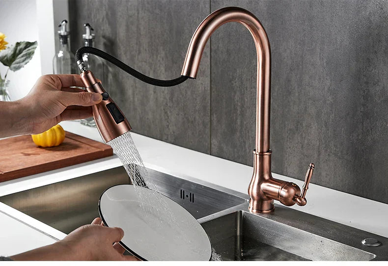 DecorBites™ antique bronze kitchen faucet with rose gold finish, sleek curved spout, and black flexible hose