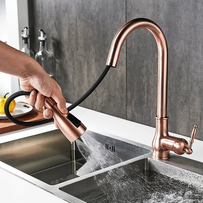 DecorBites™ antique bronze kitchen faucet with copper finish, sleek arched spout, and black flexible pull-out hose