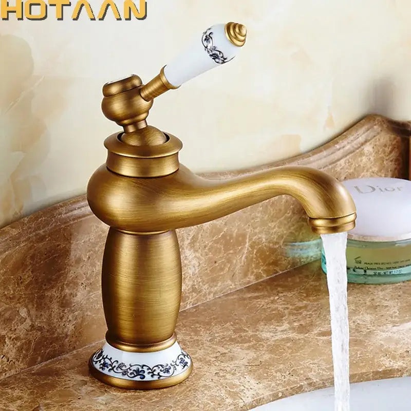 DecorBites™ antique bronze single handle basin faucet with brass finish and white ceramic handle with blue floral patterns