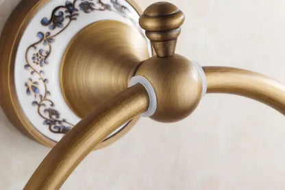 Decorbites antique bronze towel ring with antique brass finish and blue floral ceramic backplate for bathroom use