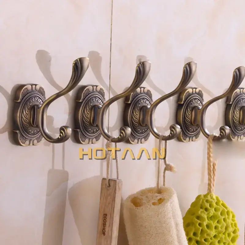 DecorBites™ antique bronze wall hooks with ornate scrollwork and curved hooks for towels coats and robes