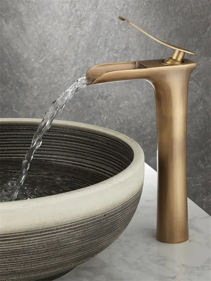DecorBites antique bronze waterfall bathroom faucet with brass finish, sleek tall design, and curved spout for hot and cold mixer tap