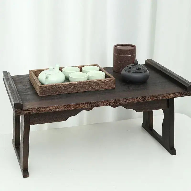 Dark wood solid wood foldable table with carved legs and scalloped edge for hanfu shoots and tea cooking