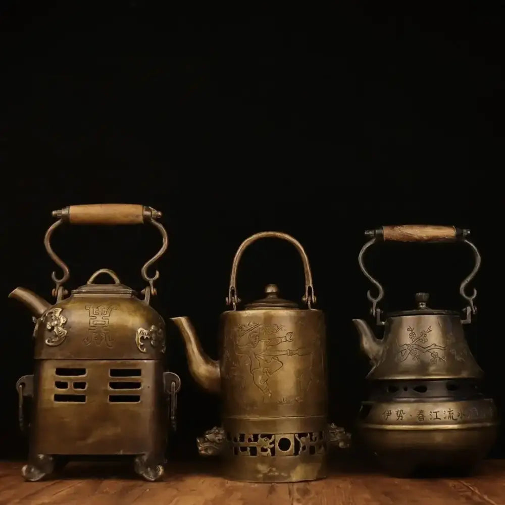 Three antique brass warm wine pots with wooden handles and intricate engraved designs from decorbites™ antique collection